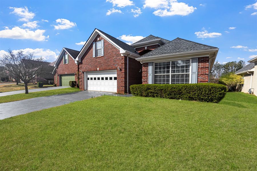 Red brick house with a large lawn