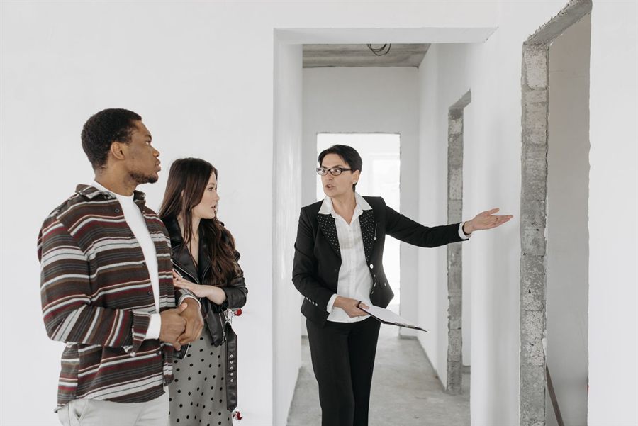 Agent showing a house to a couple
